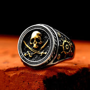Pirate ring featuring skull and crossbones design with gold accents.