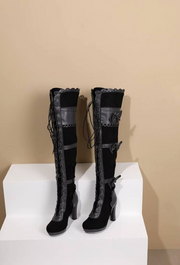Front display view of black Lolita thigh-high boots with lace and bows