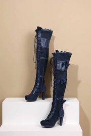 Side display view of navy Lolita over-the-knee boots with lace-up design