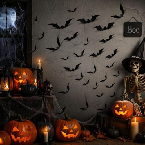 Black 3D Halloween bat decorations displayed on a wall in a spooky haunted house scene