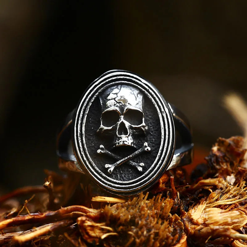 Centered view of The Black Tide ring showcasing the prominent skull and crossbones design with detailed edges.