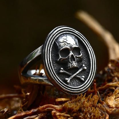 Front view of The Black Tide stainless steel ring featuring an engraved skull and crossbones on an oval face.