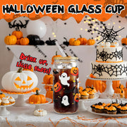Halloween glass cup with ghost and pumpkin designs for festive drinks