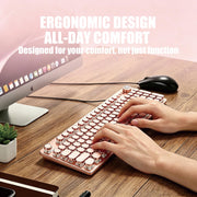 Pink retro typewriter keyboard used at a desk with ergonomic full-size layout