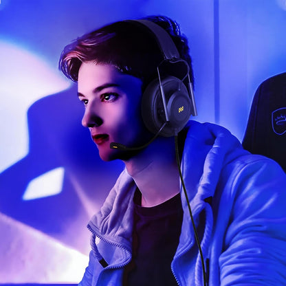 Gamer wearing the COLUSI M21 headset while gaming under a neon light setting.