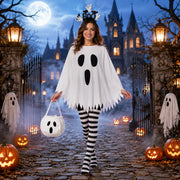 Woman wearing women’s ghost Halloween costume with BOO headband and candy bag outdoors at night