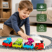 Children playing with a dinosaur train toy on a railway track