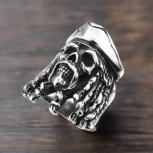 Detailed view of The Dreaded Buccaneer ring, featuring a bold pirate skull with wild dreadlocks crafted in stainless steel.