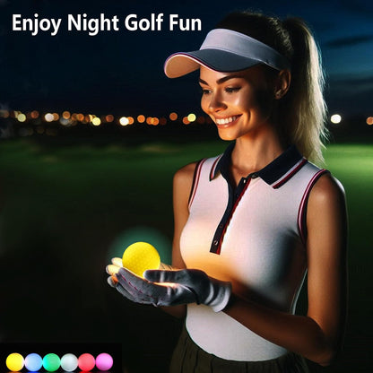 Smiling golfer holding a glowing yellow golf ball during a night game.