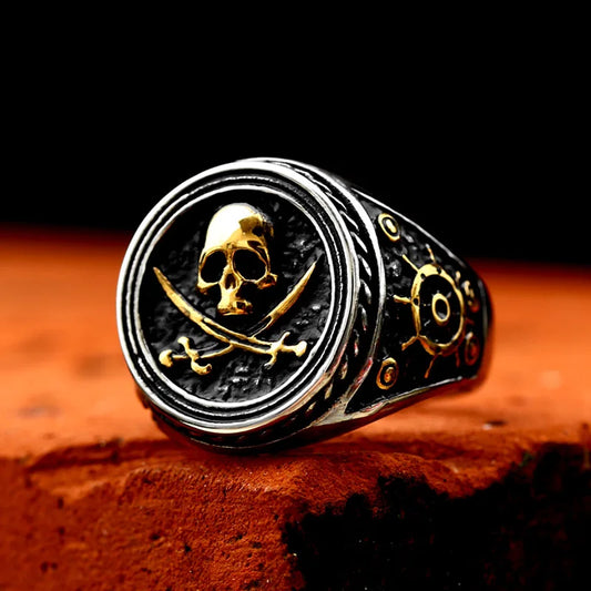 Pirate ring featuring skull and crossbones design with gold accents.