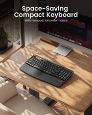 ProtoArc EK02 black ergonomic wireless keyboard on a modern home office desk