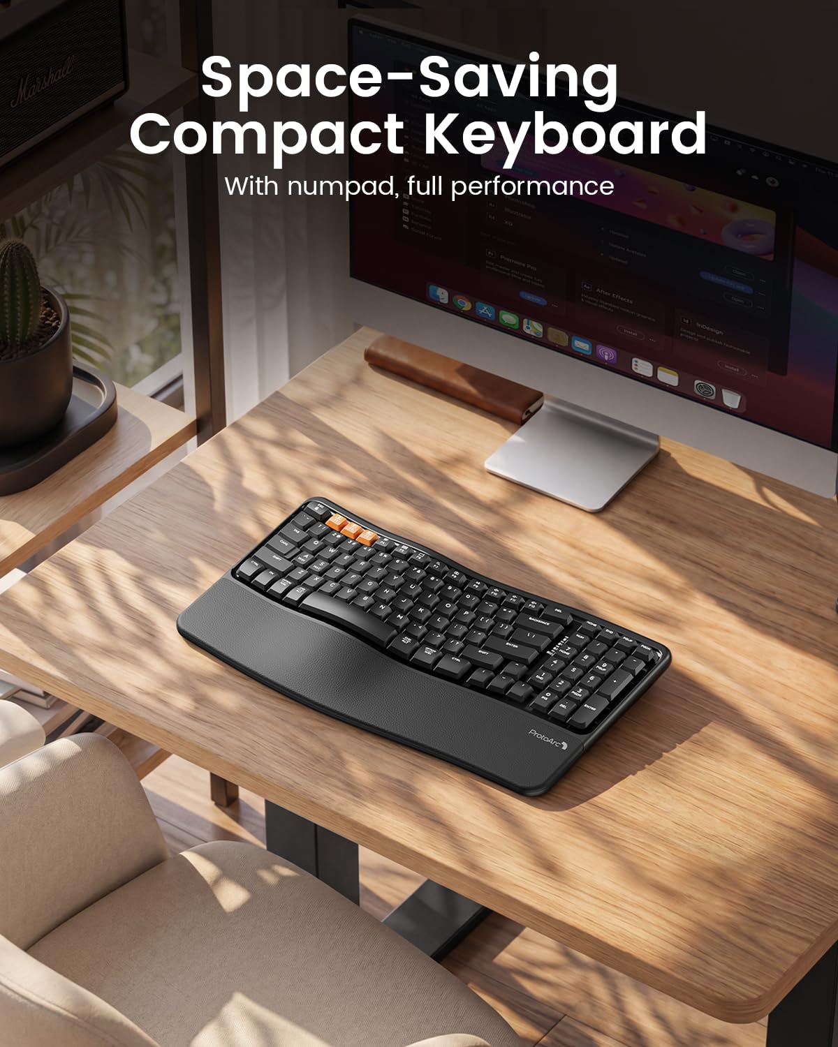 ProtoArc EK02 black ergonomic wireless keyboard on a modern home office desk