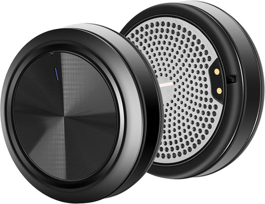 Close-up of black wireless ski helmet speakers showing their sleek, compact design and audio grille.