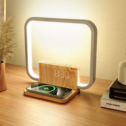 Sunrise alarm clock with wireless charging and LED display on a wooden nightstand, glowing softly at night.