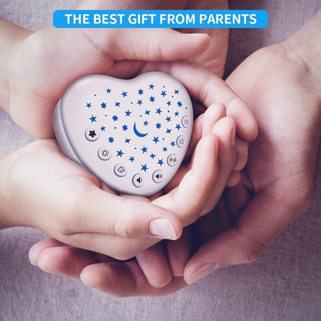 Compact heart-shaped baby white noise machine in parent’s hands