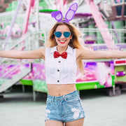 Woman wearing purple bunny ears and red bow tie at party event