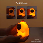 Soft silicone capybara night light shown handheld with squishy texture