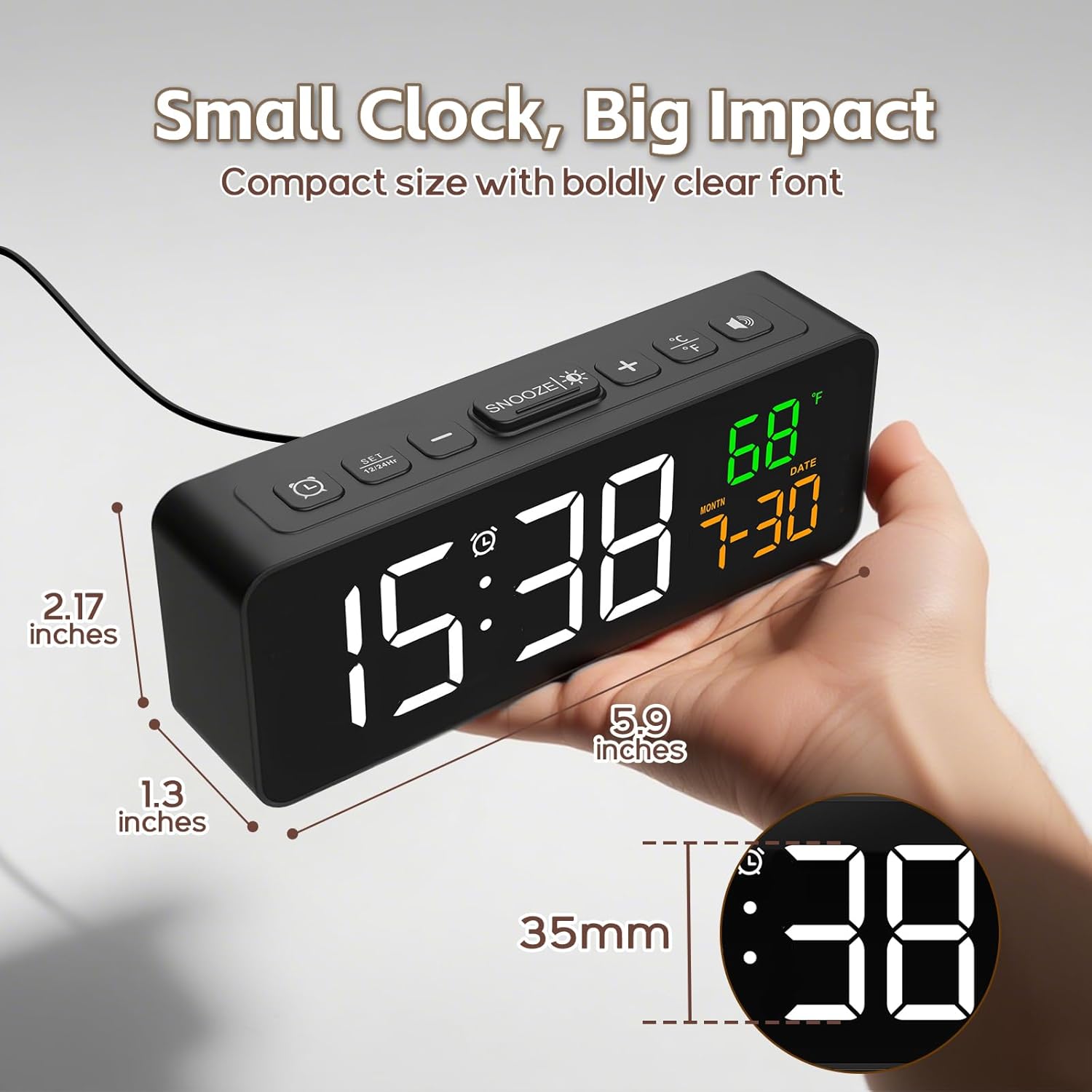 Hand holding compact Netzu clock to show size and clear LED display