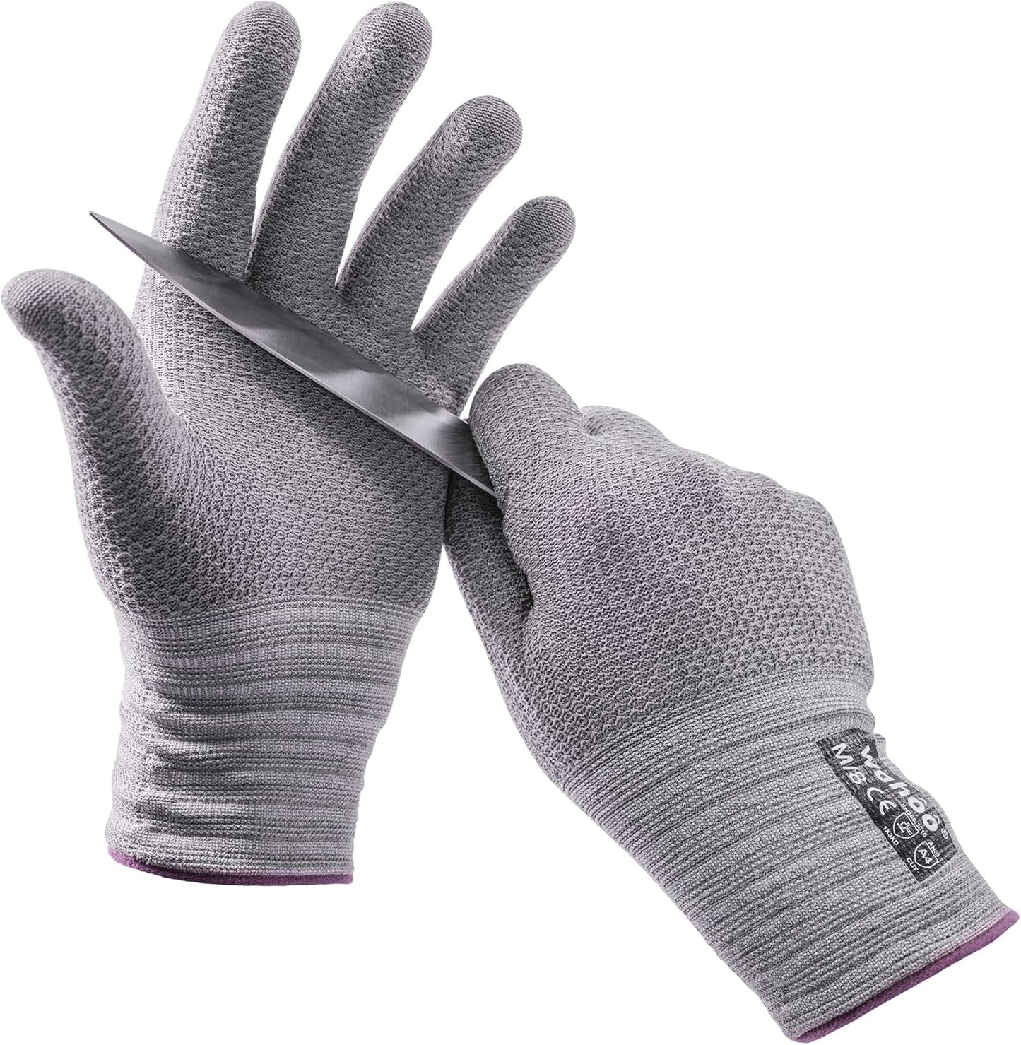 Pair of food-grade cut-resistant gloves protecting hands while holding a knife.