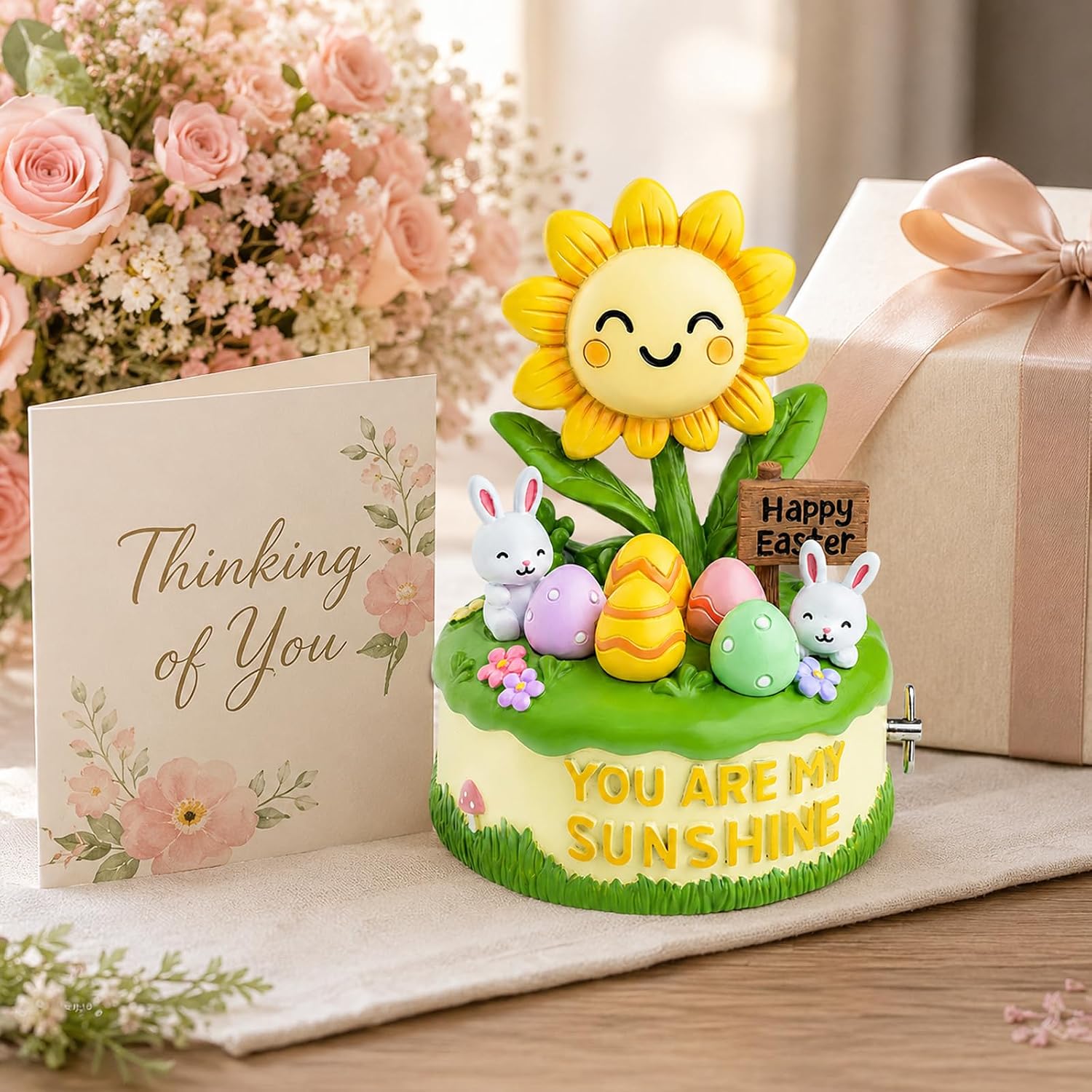 Hand-painted Easter sunflower music box beside flowers and gift box