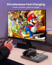 Joy-Con charging dock for Nintendo Switch 2 beside gaming setup