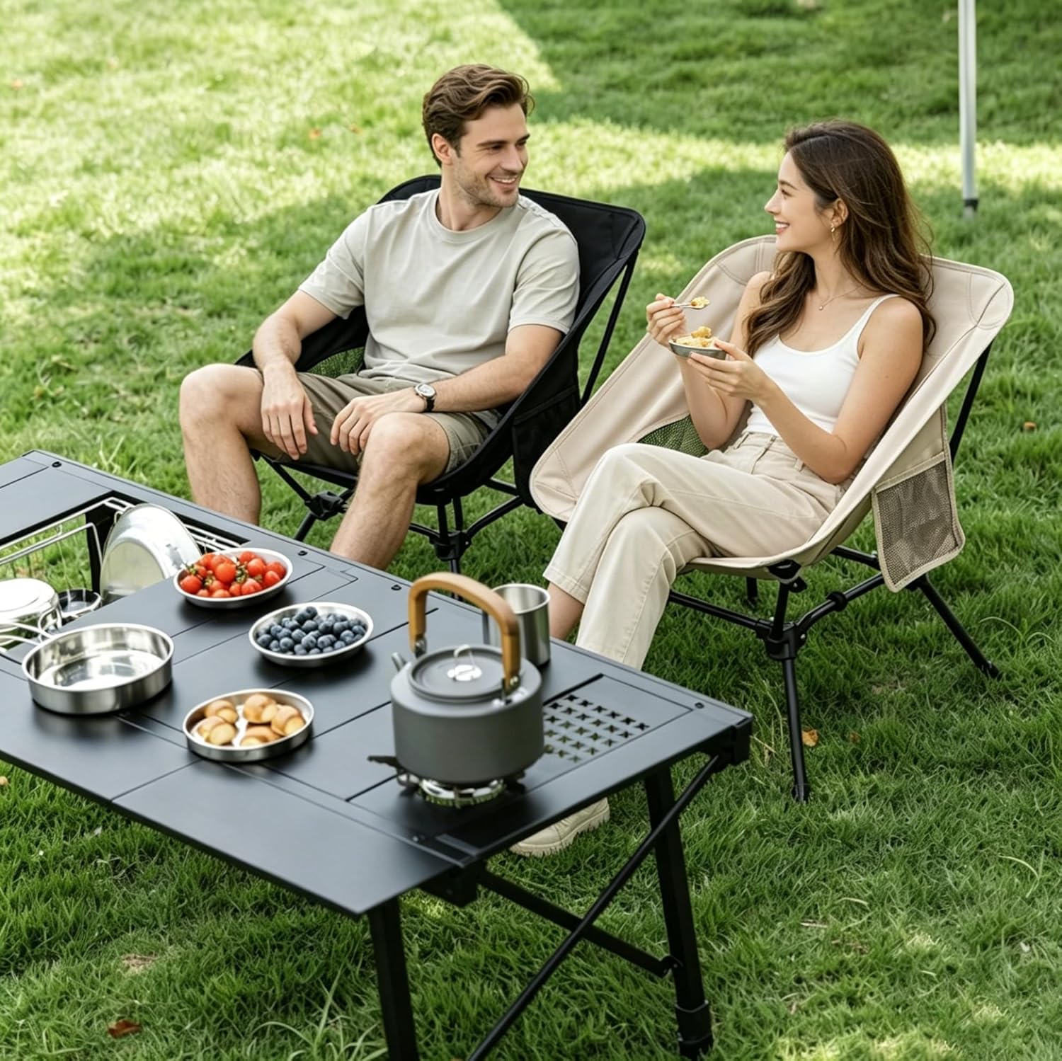 Lightweight camping chairs beside outdoor picnic table