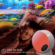 Child sleeping with starry night light and ocean projection