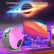 Bluetooth-enabled galaxy projector playing music at a desk