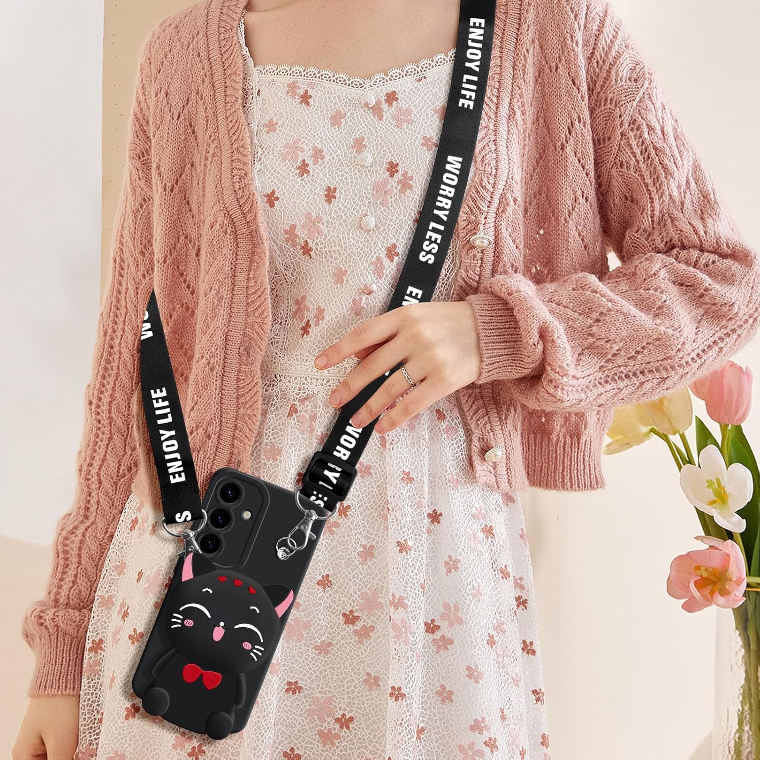 Little girl wearing Samsung Galaxy S24 black cat phone case crossbody