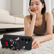 Black cat phone case for Samsung Galaxy S24 used as phone stand