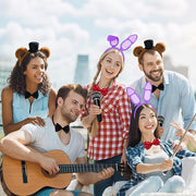 Group wearing bunny ears costume accessories at themed party