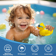 Toddler holding waterproof baby bath thermometer duck