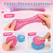 Pink heart sensory fidget toy being squeezed and stretched