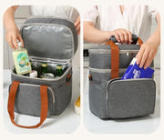 Lunch bag storing drinks, with wide top opening and convenient outer pocket.