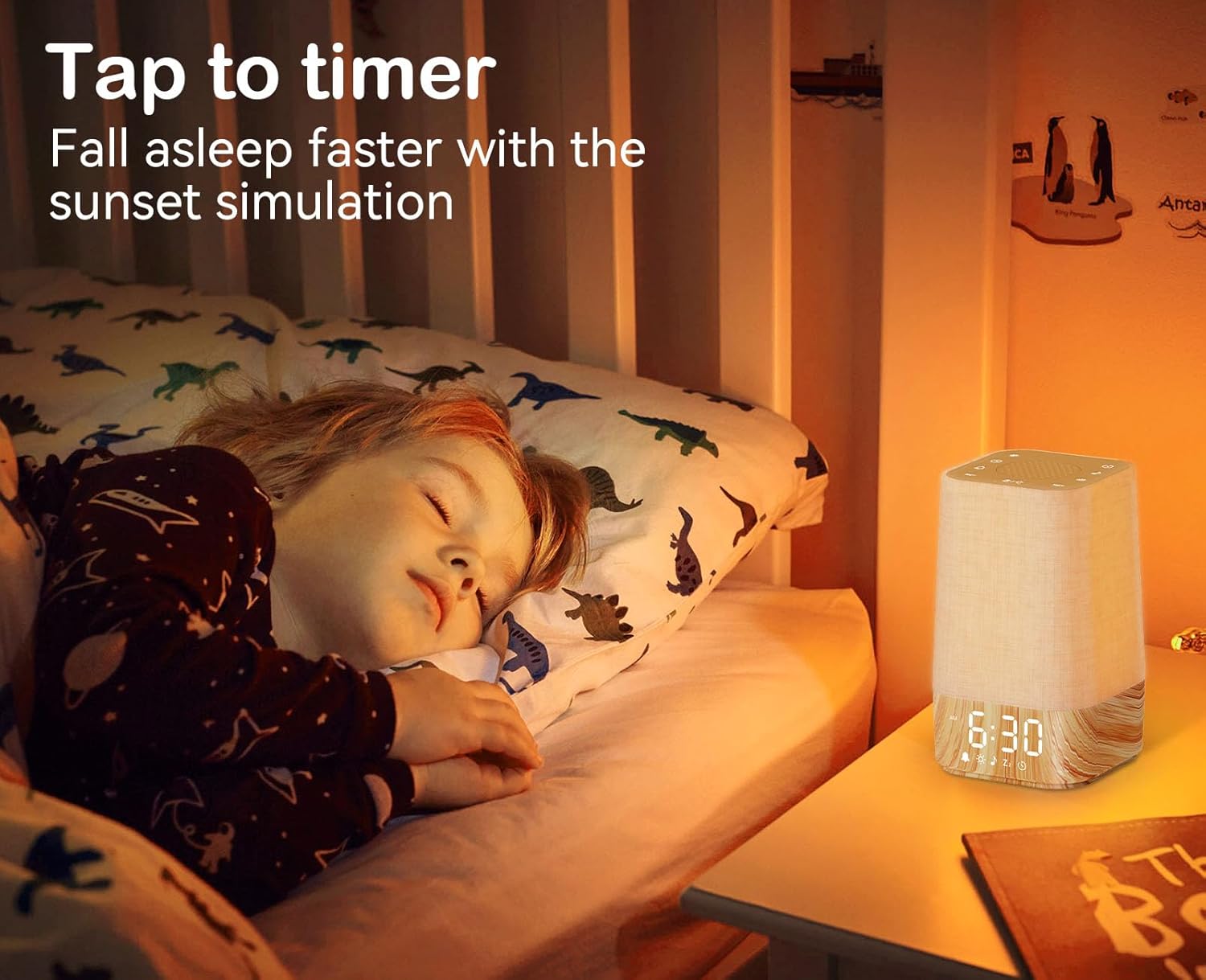 Child sleeping peacefully beside alarm clock with sunset simulation.