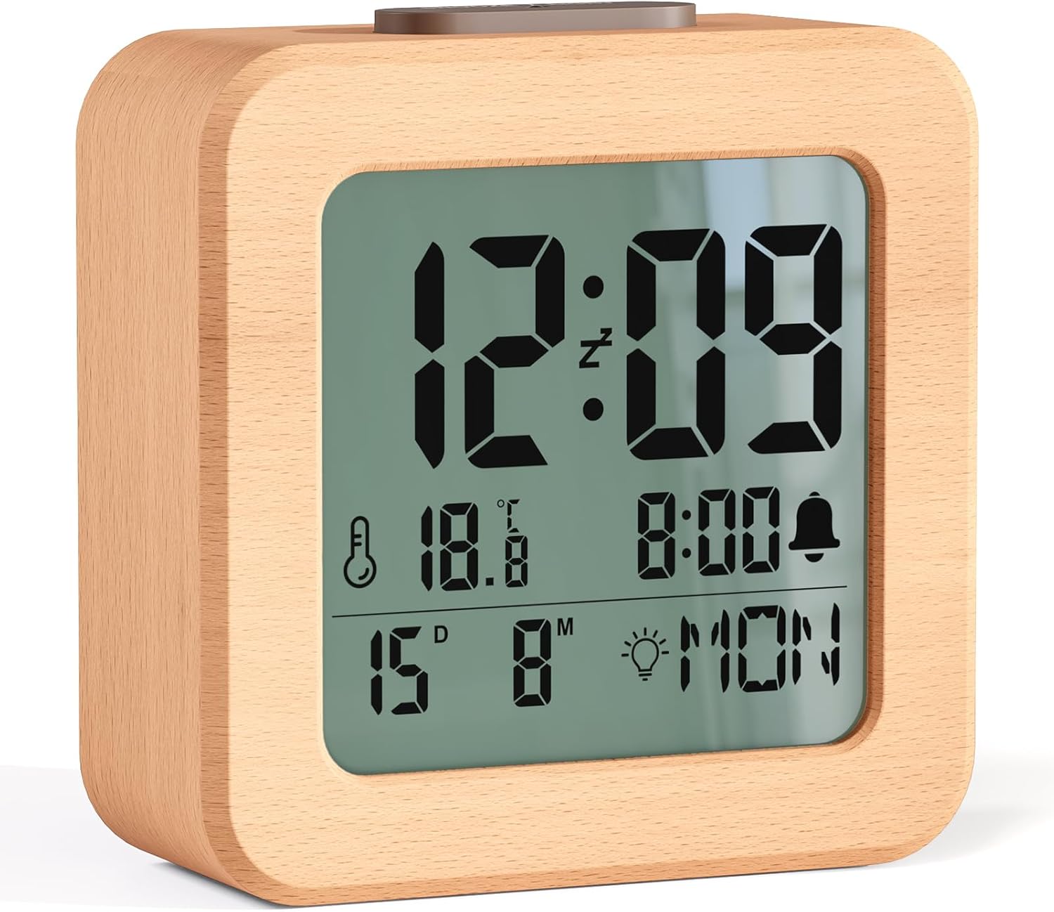 Close-up of wooden alarm clock LCD display showing time temperature and date