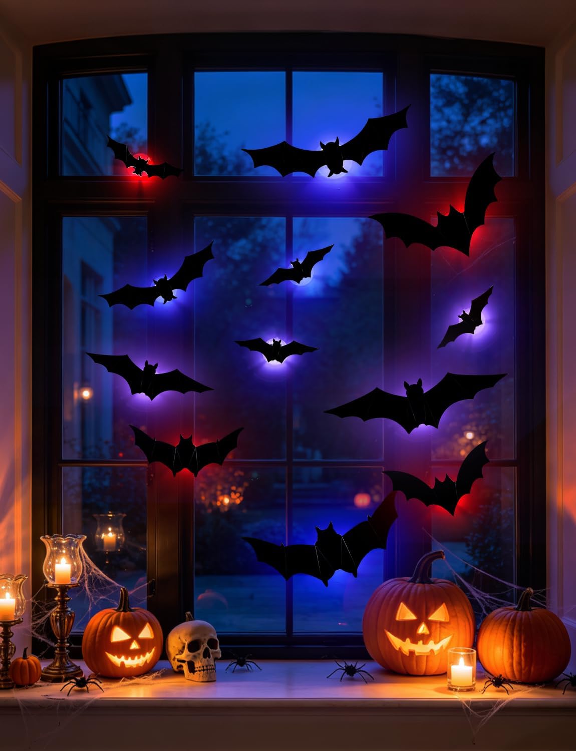 LED bat Halloween decorations displayed on a window with colorful lighting