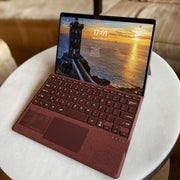 Mobee burgundy Surface Pro keyboard cover in use