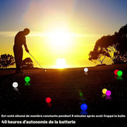LED golf balls glowing during evening golf practice