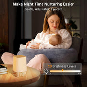 Mom using the soft light night lamp while nursing a baby.
