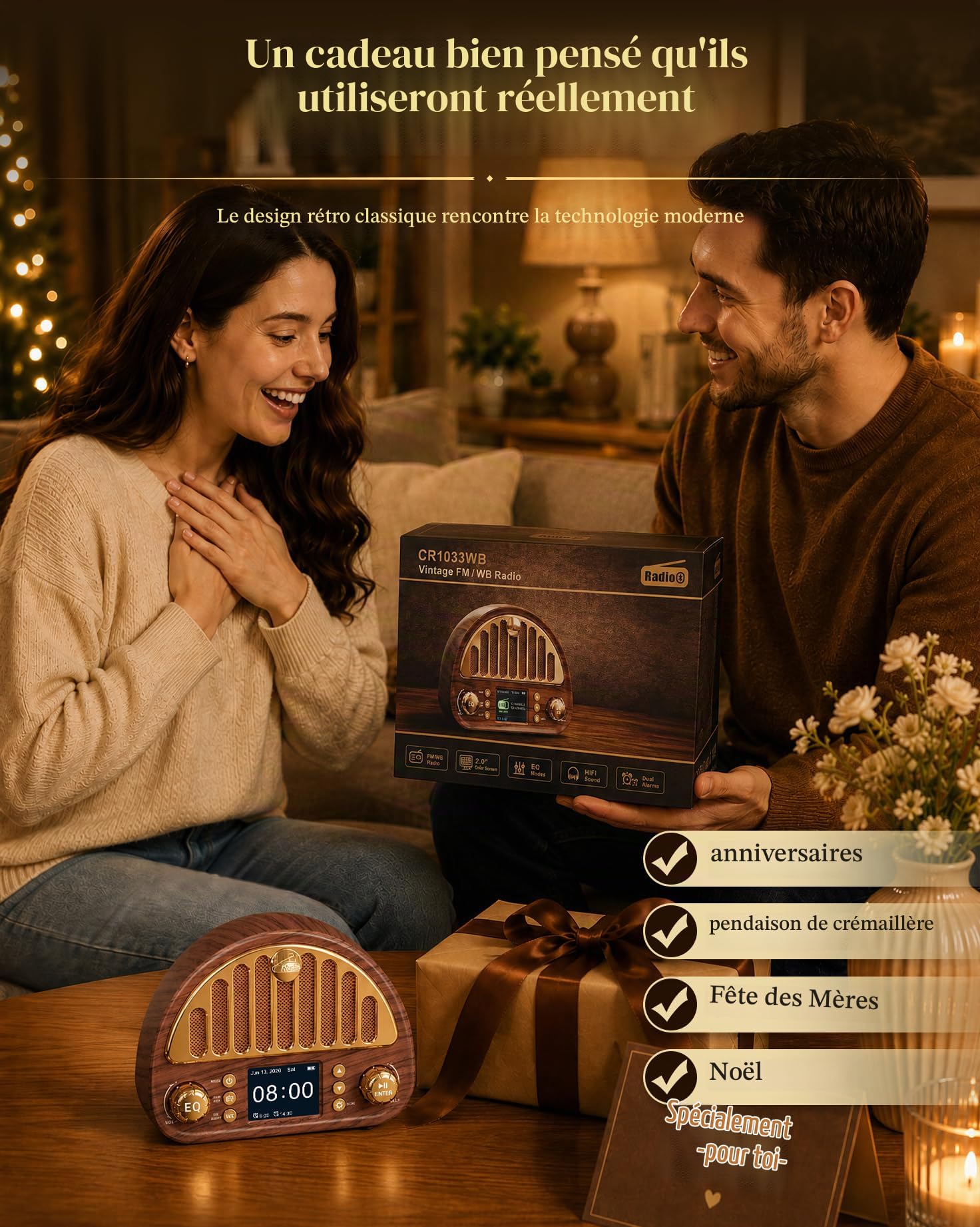 A man and woman sitting together in a warmly lit living room, smiling while holding a boxed product. In the foreground, a small round retro-style radio sits on a table next to wrapped gifts and a candle.