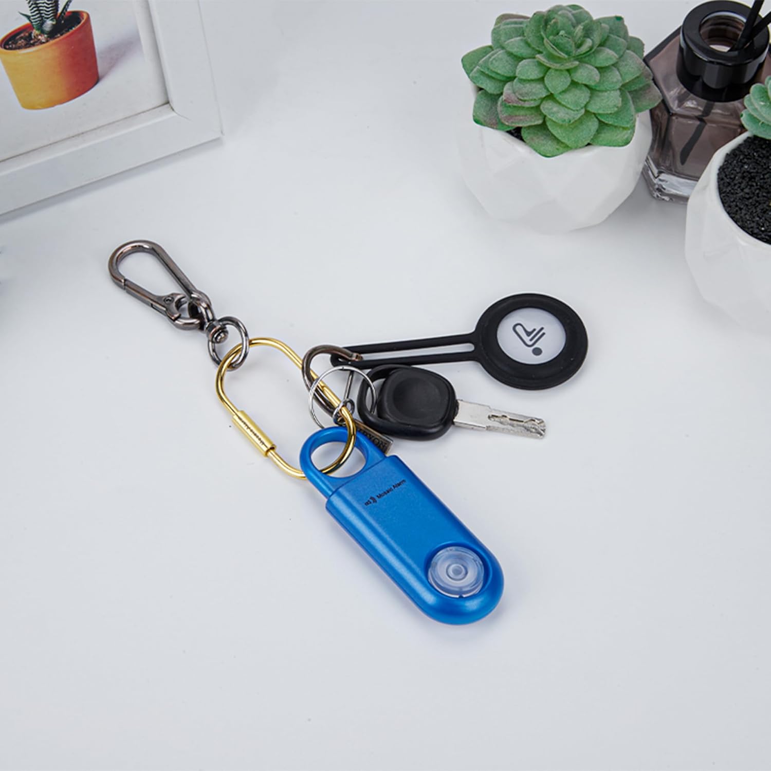 Personal safety alarm attached to keys and keychain accessories