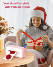 Woman using Phomemo printer to label a Christmas gift