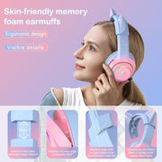 Woman wearing pink cat ear gaming headset with memory foam earmuffs