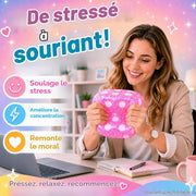 Woman squeezing a pink jumbo squishy dice during a study and desk break