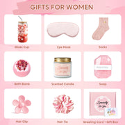 Contents of pink spa gift set including bath bomb eye mask glass cup and hair accessories