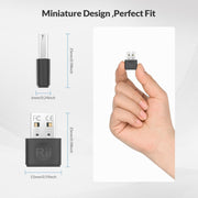 Miniature size of Rii Bluetooth 5.4 Adapter shown in hand.