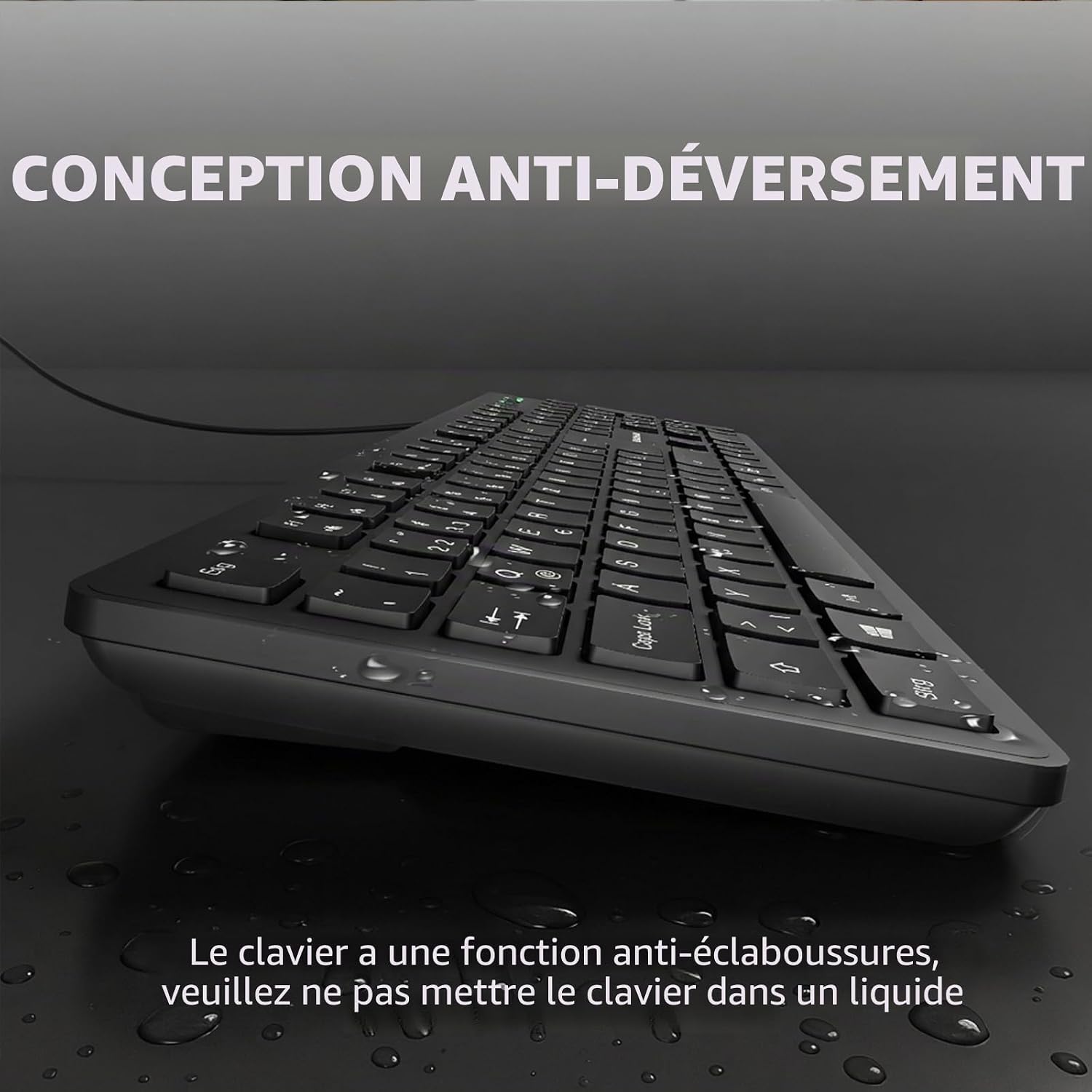A black computer keyboard shown at an angle on a dark reflective surface with water droplets. Large French text at the top reads 'CONCEPTION ANTI-DÉVERSEMENT' and smaller text at the bottom explains a spill-resistant feature.