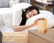 Woman using 9-minute snooze feature on gentle wake-up light.