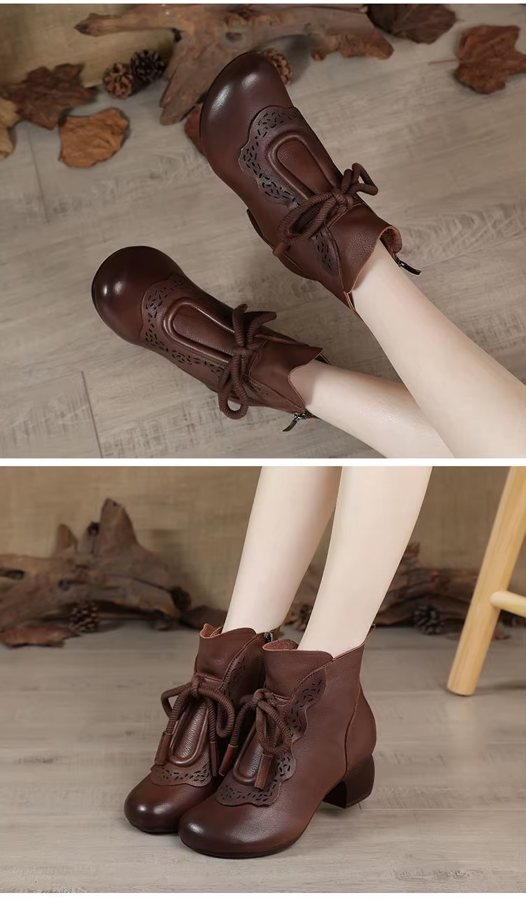 Brown PU leather ankle boots worn by model sitting on wooden floor.